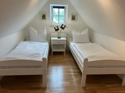 Ein Bett oder Betten in einem Zimmer der Unterkunft Haus Lykkelig