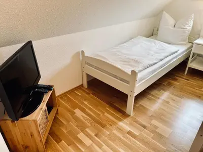 Ein Bett oder Betten in einem Zimmer der Unterkunft Haus Lykkelig