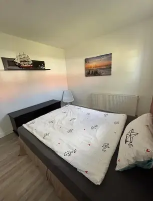 Ein Bett oder Betten in einem Zimmer der Unterkunft Ahoi Zingst