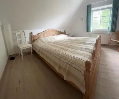 Ein Bett oder Betten in einem Zimmer der Unterkunft Strandgut