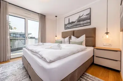Ein Bett oder Betten in einem Zimmer der Unterkunft Strandvilla Zingst- AP 16