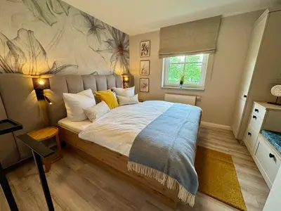 Ein Bett oder Betten in einem Zimmer der Unterkunft BIRKENHOF Haus 08, App 45