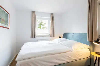 Ein Bett oder Betten in einem Zimmer der Unterkunft Boddenräuber 3