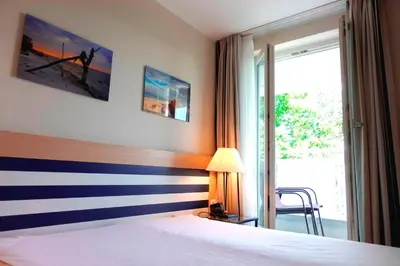 Ein Bett oder Betten in einem Zimmer der Unterkunft An der Seebrücke
