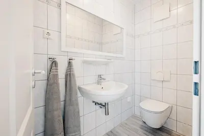 Ein Badezimmer in der Unterkunft Am Deich 31 Haus Sommerliebe