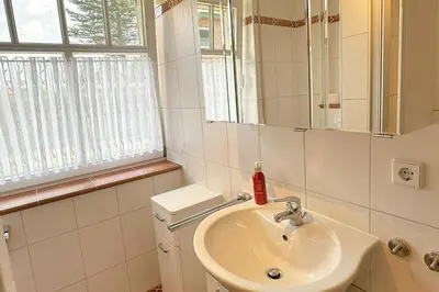 Ein Badezimmer in der Unterkunft W1 HzL