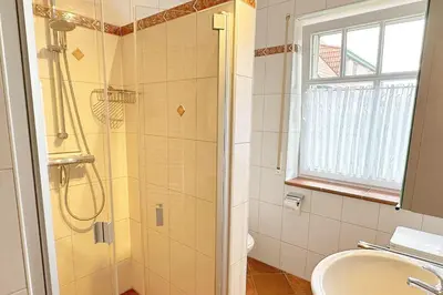 Ein Badezimmer in der Unterkunft W1 HzL