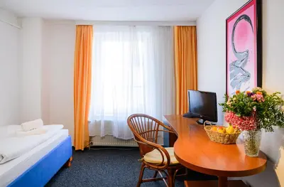 Ein Bett oder Betten in einem Zimmer der Unterkunft Vinetahotel Stadt Barth