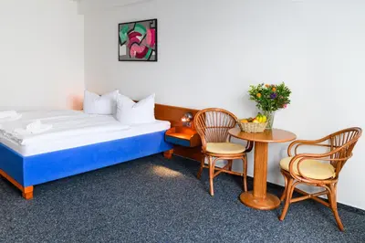 Ein Bett oder Betten in einem Zimmer der Unterkunft Vinetahotel Stadt Barth