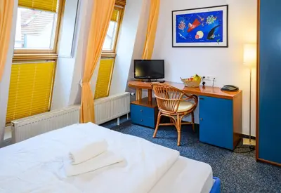 Ein Bett oder Betten in einem Zimmer der Unterkunft Vinetahotel Stadt Barth