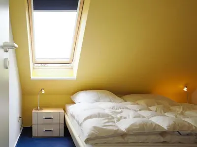 Ein Bett oder Betten in einem Zimmer der Unterkunft Fewo Brunnen W6
