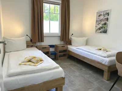 Ein Bett oder Betten in einem Zimmer der Unterkunft Waldstrasse Nr3