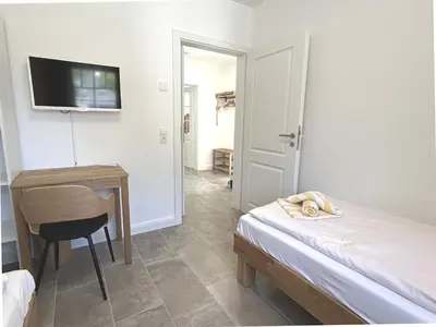 Ein Bett oder Betten in einem Zimmer der Unterkunft Waldstrasse Nr3
