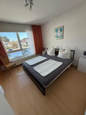 Ein Bett oder Betten in einem Zimmer der Unterkunft Likeedeler Weg 1, Haus Böde, Whg 20