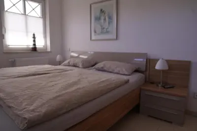 Ein Bett oder Betten in einem Zimmer der Unterkunft Ferienwohnung Brigantine auf der Halbinsel Zingst