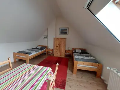 Ein Bett oder Betten in einem Zimmer der Unterkunft Birkenquartier