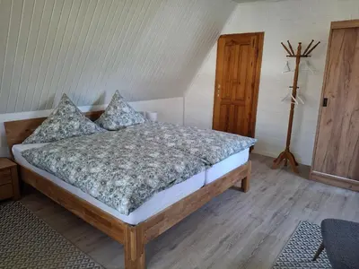 Ein Bett oder Betten in einem Zimmer der Unterkunft Ferienwohnung am Badesteig