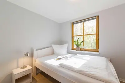 Ein Bett oder Betten in einem Zimmer der Unterkunft Ferienhaus Dierhagen am Deich