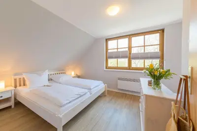 Ein Bett oder Betten in einem Zimmer der Unterkunft Ferienhaus Dierhagen am Deich