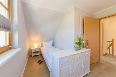 Ein Bett oder Betten in einem Zimmer der Unterkunft Ferienhaus Dierhagen am Deich
