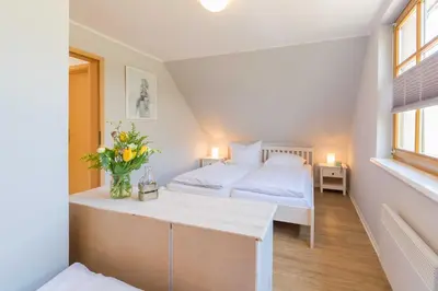 Ein Bett oder Betten in einem Zimmer der Unterkunft Ferienhaus Dierhagen am Deich