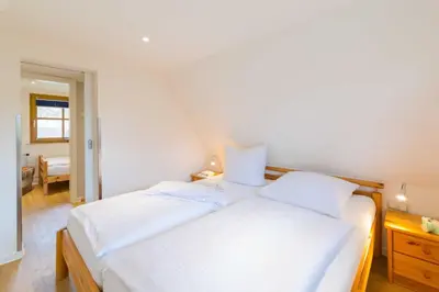 Ein Bett oder Betten in einem Zimmer der Unterkunft Reethaus in Dierhagen