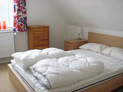 Ein Bett oder Betten in einem Zimmer der Unterkunft Ferienhaus in Bartelshagen II