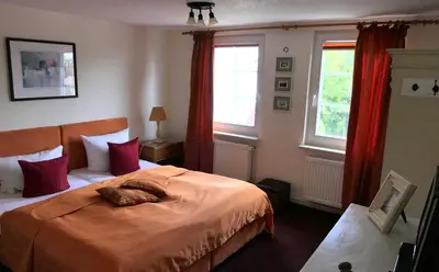 Ein Bett oder Betten in einem Zimmer der Unterkunft Kapitänshaus in Strandnähe in Prerow