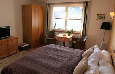 Ein Bett oder Betten in einem Zimmer der Unterkunft Kapitänshaus in Strandnähe in Prerow