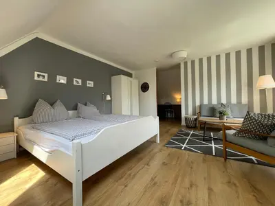 Ein Bett oder Betten in einem Zimmer der Unterkunft Schmidt's Gasthof Garni