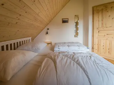Ein Bett oder Betten in einem Zimmer der Unterkunft Schmidt's Ferienhäuser bei Zingst