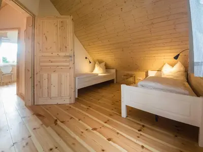 Ein Bett oder Betten in einem Zimmer der Unterkunft Schmidt's Ferienhäuser bei Zingst