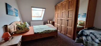 Ein Bett oder Betten in einem Zimmer der Unterkunft Ferienhaus An der Heide