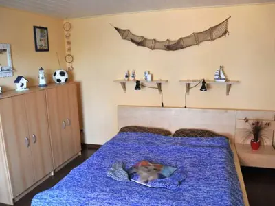 Ein Bett oder Betten in einem Zimmer der Unterkunft Ferienwohnung Neuendorf