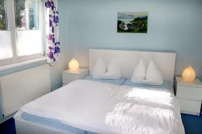 Ein Bett oder Betten in einem Zimmer der Unterkunft Haus Kleist Wohnung 3