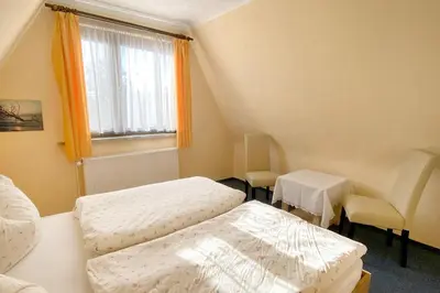 Ein Bett oder Betten in einem Zimmer der Unterkunft Lewerenz