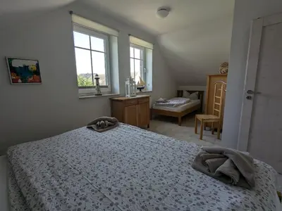Ein Bett oder Betten in einem Zimmer der Unterkunft An de Bäk - Dat Dardel Hus