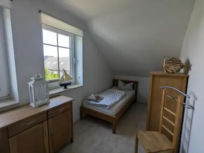 Ein Bett oder Betten in einem Zimmer der Unterkunft An de Bäk - Dat Dardel Hus