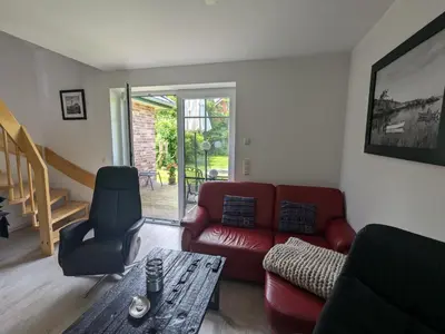 Ein Sitzbereich in der Unterkunft An de Bäk - Dat Dardel Hus