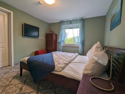 Ein Bett oder Betten in einem Zimmer der Unterkunft Dat smucke Reethus - EG