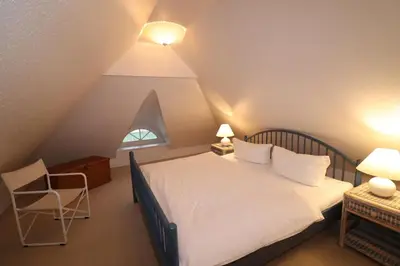 Ein Bett oder Betten in einem Zimmer der Unterkunft Am Boddenweg - Windsbraut