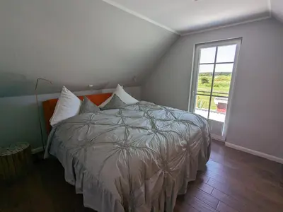 Ein Bett oder Betten in einem Zimmer der Unterkunft An der Koppel