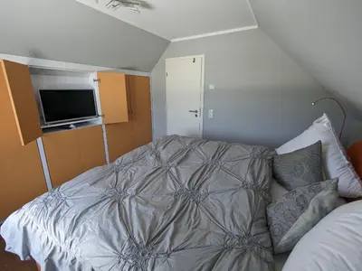 Ein Bett oder Betten in einem Zimmer der Unterkunft An der Koppel