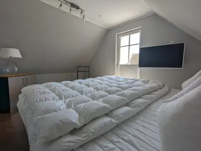 Ein Bett oder Betten in einem Zimmer der Unterkunft An der Koppel