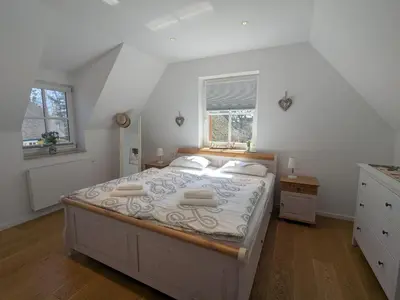 Ein Bett oder Betten in einem Zimmer der Unterkunft Am Wald