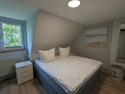 Ein Bett oder Betten in einem Zimmer der Unterkunft Ankerplatz