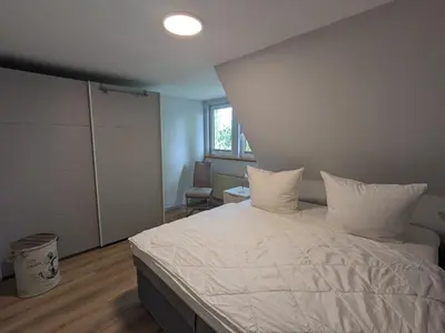 Ein Bett oder Betten in einem Zimmer der Unterkunft Ankerplatz