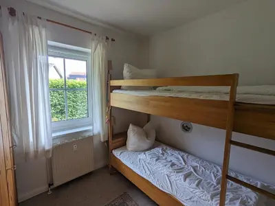 Ein Bett oder Betten in einem Zimmer der Unterkunft Auster