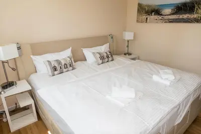 Ein Bett oder Betten in einem Zimmer der Unterkunft Premiumhaus Bodden