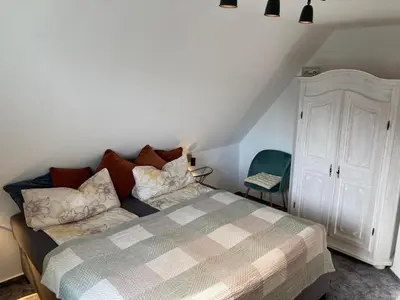 Ein Bett oder Betten in einem Zimmer der Unterkunft Lütt Klönhus